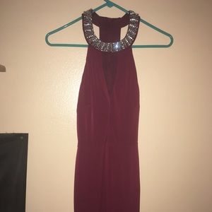 Maroon body-con dress with beading and open back.